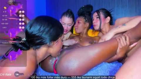 Media: A video of four nude women, of various skin tones, engaged in an intimate moment, set in a dimly lit room with blue lighting.