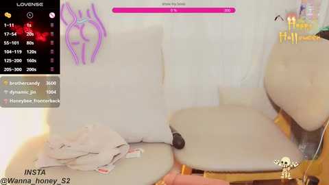 Media: A video captures a steamy scene with a woman in a white bra and panties, sitting on a beige chair, surrounded by a messy room with clothes strewn about. The background shows a pink health bar and a purple outline of a bunny.