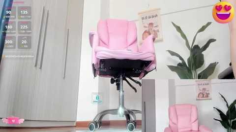 Media: Video of a pink office chair on a metal stand in a modern, minimalist room with white walls, potted plants, and a poster.