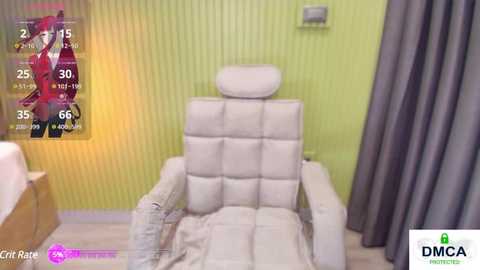 Media: Video of a modern, white, cushioned recliner chair in a bright, green-walled room with light wooden flooring. A fitness tracker screen with a red fox image is superimposed on the left.