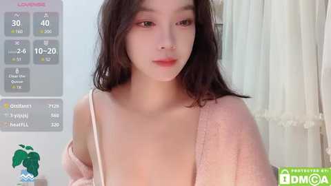 Media: Video of an Asian woman with fair skin, long dark hair, and wearing a light pink, off-shoulder sweater. Background shows a virtual dating app interface with contact details.