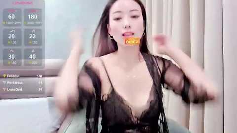 Media: A blurred video of an Asian woman with fair skin, wearing a black lace top, with a \"DICK\" sign on her mouth, surrounded by a smartphone screen showing health data.