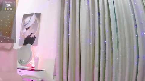 Media: Video of a modern bathroom with a white toilet, a black-and-white portrait of a woman, and a silver curtain with a subtle, sparkly pattern. The room is softly lit with purple and green hues.