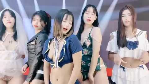 Media: Video of five Asian women in revealing outfits with large breasts, performing on stage.