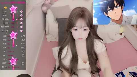 Media: A digital photo of a young Asian woman with long brown hair and fair skin, wearing a white top, lying on a pink bed. A video game UI is overlayed with icons and a character's face in the corner.