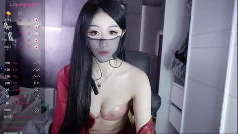 Media: Video of an East Asian woman with long black hair, fair skin, and large breasts, wearing a red bra and necklace, captured in a dimly-lit room with a \"Lover's Room\" interface overlay.