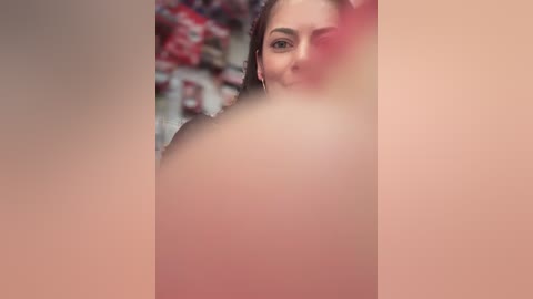 Media: Video of a young woman with light skin and dark hair, partially obscured by a blurred, soft-focus filter, creating a dreamy, surreal effect.