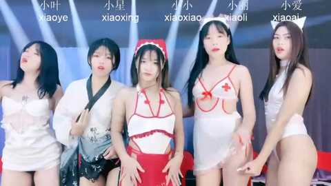 Media: Video of five Asian women in revealing nurse-themed lingerie, including a white maid outfit and red cross uniform, posing against a blue and white background.