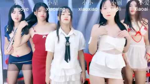 Media: Video of four Asian women in provocative attire, including a red dress, white shirt, and white dress, against a blurred background.