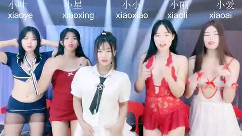 Media: Video of five Asian women, each in revealing lingerie, posing against a modern stage with Chinese text, exuding confidence and seduction.