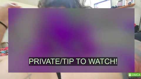 Media: A video of a purple filter over a person's face, with a \"PRIVATE: TIP TO WATCH!\" overlay in bold white text. The background shows a messy room with a television and shelves.