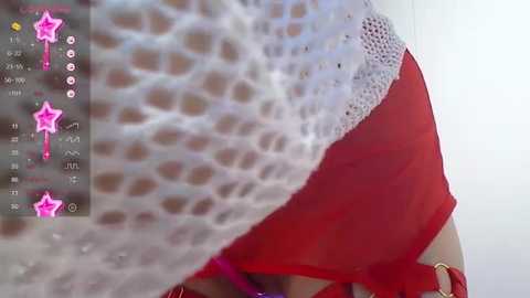 Media: A close-up video of a woman's leg and buttock, clad in a white lace bra and red underwear, with a pink star overlay.