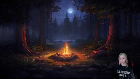 Media: Video of a serene, moonlit forest with a glowing campfire, surrounded by dark, towering trees and lush undergrowth. A blonde woman in a black hoodie stands beside the fire, her face partially visible.