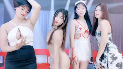 Media: Video of four Asian women, one in a revealing white top, others in sexy nurse outfits, posing seductively indoors with white curtains and red chairs in the background.