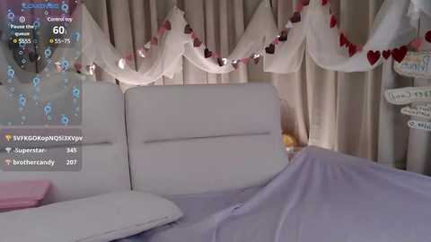 Media: A video of a cozy bedroom with a white bed, white curtains, and a heart-decorated canopy. A \"TikTok\" overlay displays a username, views, likes, and a timestamp.