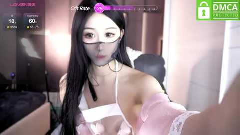 Media: A video shows an Asian woman with long black hair and glasses, wearing a white lace bra, seated on a bed. The image is overlaid with virtual reality elements and health stats.