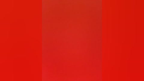 Media: Video of a solid, vibrant red background with no visible objects or textures, creating a uniform and intense color gradient.