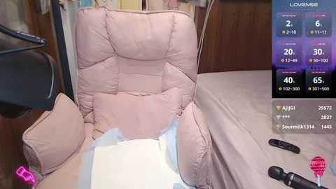 Media: A video of a hospital room with a pink recliner chair, a tablet, and medical equipment, including a monitor displaying vital signs.