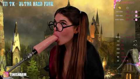 Media: Video of a woman with long brown hair in pigtails, wearing glasses, performing oral sex on a large, realistic-looking dildo, set against a backdrop of a medieval castle and forest, overlaid with Twitch chat and stats.