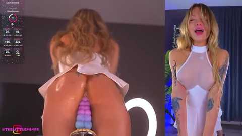 Media: Video of a blonde woman bent over, showing her buttocks and a rainbow dildo; another image of her in a sheer white top and skirt, smiling, in a dimly lit room.