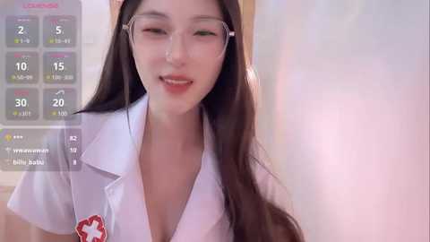 Media: A young Asian woman with long brown hair and fair skin, wearing a white nurse's uniform with a low neckline, smiling softly in a bathroom setting.