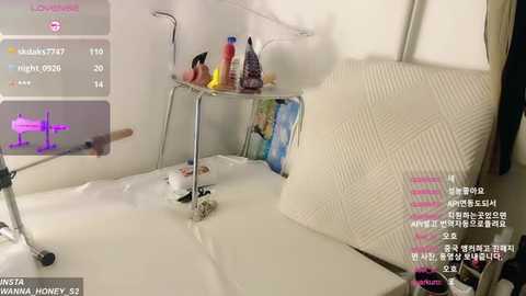 Media: A video of a messy hospital room with a bed, a small table, and medical supplies scattered on the floor.