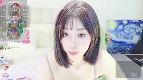 Media: Video of an Asian woman with straight, shoulder-length black hair, light skin, and a slender physique, wearing a pink bra. Background shows a modern bedroom with a bed, a TV playing a Van Gogh painting, and a virtual overlay displaying a game character.