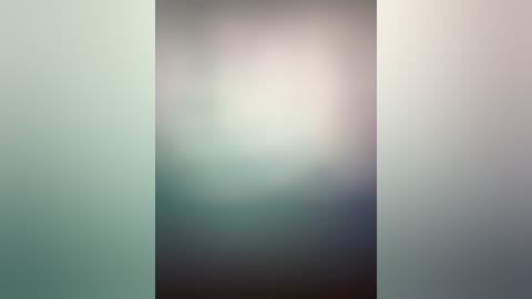 Media: A soft-focus video of a person standing in the center, their face blurred, surrounded by a gradient background transitioning from light green to beige. The image lacks distinct details, creating a serene and abstract atmosphere.