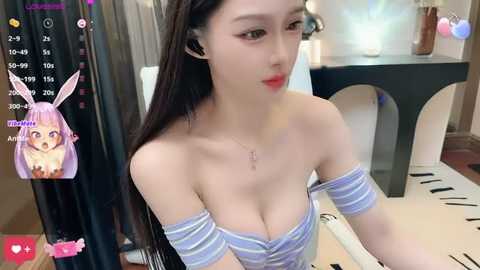 Media: A video of an East Asian woman with long, straight black hair and large breasts, wearing a striped off-shoulder top. She's sitting in a room with a black table and a white chair, with a live stream overlay.