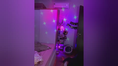 Media: Video of a dimly lit, purple-lit bedroom with a bed, air conditioner, bookshelf, and decorations, featuring a mirror reflecting a person partially visible.