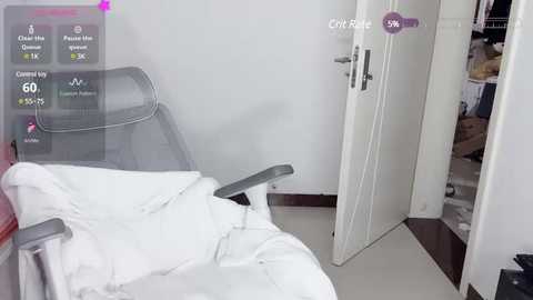 Media: Video of a modern, minimalist bedroom with a white bed, gray chair, and open closet door revealing neatly organized clothes; virtual overlay shows health and fitness data.