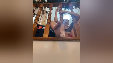 Media: Video of a group of young people, predominantly men, celebrating at a staircase, some holding beers, festive garlands in the background.