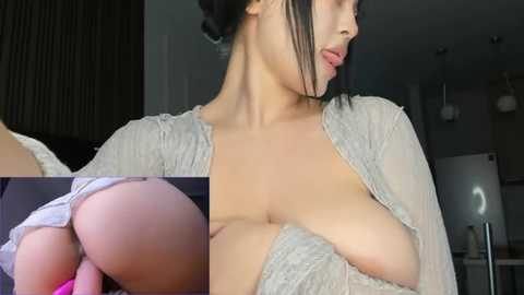 Media: A close-up video of an Asian woman with medium skin tone, wearing a sheer, open cardigan, revealing her large breasts and nipples. A side view shows her bare buttocks. Background features modern kitchen elements.