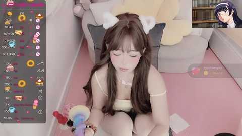 Media: A young woman with long brown hair and cat ears, wearing a white crop top and shorts, sits on a pink carpet in a cozy room. A video game interface and an anime character are overlaid.