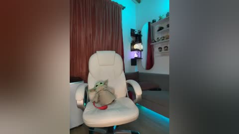 Media: Video of a cozy living room with a plush white gaming chair, a green plush Grogu doll on the chair, and a teal ambient light.