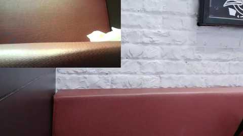 Media: Video of a corner of a room with a white brick wall and a brown leather sofa. A piece of white tape is visible on the sofa, and a framed picture with a black border is partially visible on the right.