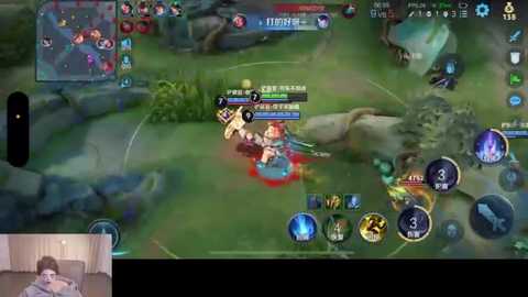 Media: Screenshot of an online multiplayer game, \"League of Legends,\" showing a detailed, colorful battlefield with players in action, user interface elements, and a small inset showing a live streamer playing the game.