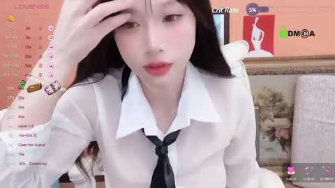 Media: A video of a young Asian woman with long black hair, fair skin, and red lips, wearing a white shirt and black tie, sitting indoors, with a virtual background of a calendar and gaming logos.