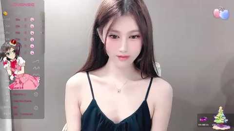 Media: Video of an Asian woman with long, straight brown hair, wearing a black spaghetti-strap dress. Background features a virtual assistant screen with a doll.