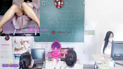 Media: Video of an Asian woman in a skirt, sitting on a desk with legs crossed, surrounded by other women in an office setting with a chalkboard and computer screens.