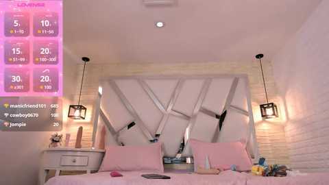 Media: Video of a modern bedroom with a white brick wall, pink bedding, geometric mirror, two hanging lamps, a white nightstand with toys, and a pink digital clock displaying weather and temperature.