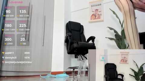 Media: Video of a modern office with a black leather office chair, a potted plant, and a framed poster on the wall. A digital thermometer displays temperature readings.