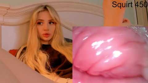 A video of a young blonde woman with fair skin, wearing a dark top, looking thoughtfully. Next to her is a close-up of pink, glossy, wet, and smooth vaginal tissue.