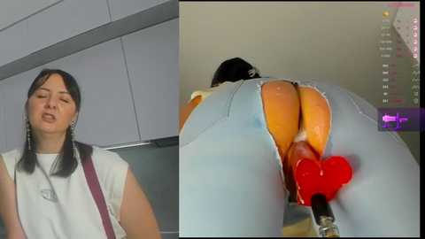 Media: A video featuring a woman with fair skin and dark hair wearing a white blouse and pants, leaning against a kitchen counter, and another image showing a woman with a tan skin tone, wearing tight jeans with a red heart-shaped vibrator inserted into her anus.