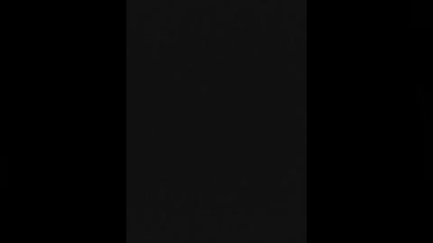 Media: A digital image featuring a central black vertical strip on a black background, creating a stark, minimalist aesthetic. The texture is smooth and the contrast between the strip and the background is sharp, emphasizing the simplicity and modern design.