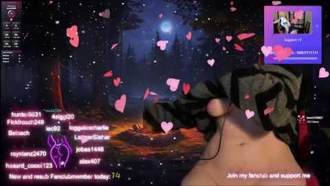 Media: A CGI screenshot from a VR game, featuring a person with black hair wearing headphones, surrounded by pink hearts in a forest at night. Text overlays include chat messages and a promotional offer.