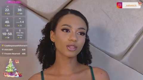 Media: Video of a young Black woman with curly hair, wearing a green top, smiling against a beige background. Social media and fitness app interface overlaid.