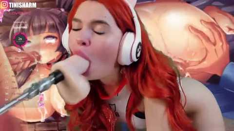 Media: A video of a woman with long red hair and white headphones, performing oral sex on a man's penis, while a second woman with brown hair watches.