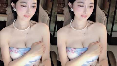 Media: Video of an East Asian woman with fair skin, long black hair, wearing a strapless white floral top, pearl necklace, and earrings, covering her breasts with her hands in two side-by-side images.