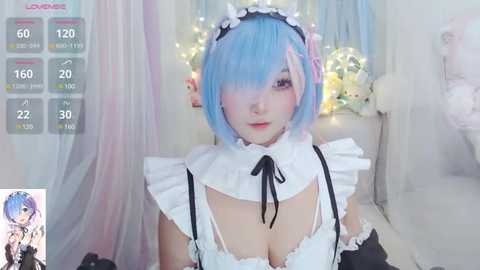 Media: Video of a pale-skinned, blue-haired cosplayer dressed as Rem from \"Re:Zero,\" wearing a frilly maid outfit with black straps. Background includes soft, pastel curtains and a glowing string of fairy lights.